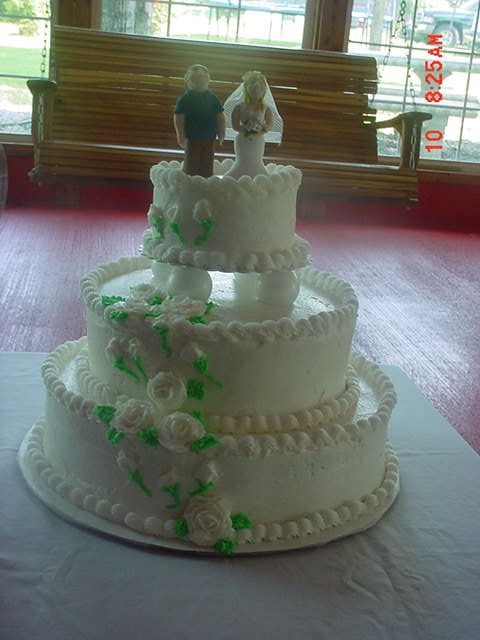 1St Wedding Cake I made this for a June wedding. The cake is frosted with buttercream and topped with clay toppers made by the groom's sister