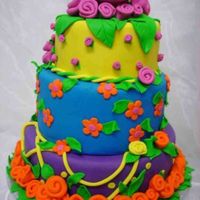 Big Pink Rose 10-8-6 fondant covered wedding cake dark chocolate layer and saffran layer with blood orange filling