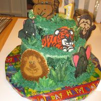 It's A Jungle Out There! cake decorated with sugar cookies frosted with buttercream