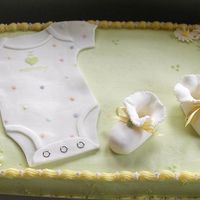 Baby Shower This cake was done in buttercream with fondant onsie and booties.