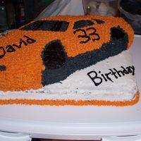Car Cake my brother is a fan of tony stewart so I tired to use his colours the best I could.