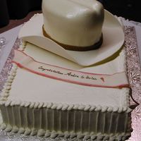 Cowboy Hat Groom's Cake Marshmallow fondant crown covering banana cake with cheesecake mousse filling. The brim is gumpaste. My first successful sculpted cake.