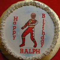 Red Power Ranger Cute cake for a 5 year old boy. Character is traced on a frosting sheet and colored with food coloring markers.