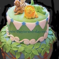 Jungle Jungle Theme Cake covered in MMF. All animals hand sculpted.