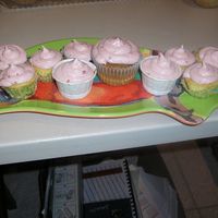 Cupcake White cupcakes filled with rasberry preserves and topped with rasberry cream cheese frosting