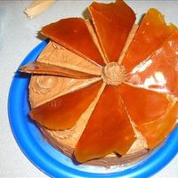 Caramel Cake Caramel cake frosted with chocolate buttercream with caramel triangles on top.