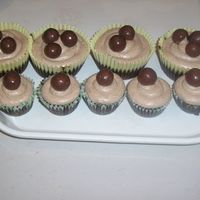 Malted Milk Chocoale Chocolate cupcakes filled with malted milk buttercream, frosted with malted milk buttercream and topped with Whoppers