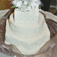 Wedding Cake This was my first wedding cake. It has three shapes, hexagon, square and round. It was a hit. Hope you enjoy it.