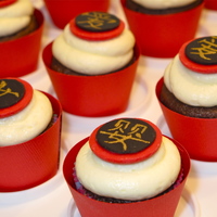 Chinese Baby Shower Cupcakes Made for a neighbor who adopted her daughter from China. The symbols are supposed to mean "baby", "daughter" and "...