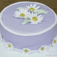 Purple Daisy Cake This was the cake I made for my final Wilton Gumpaste and Fondant class last month. The daisy's are a mixture of MMF fondant and...