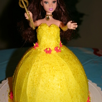 Princess Cake Vanilla cake with BC. I used a real doll and took off her legs. My daughter was so upset when she saw Bell had no legs. :) Mommy fixed them...