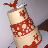 Ut Grad 3 tiered cake. 6 in, 7 in, & 9 inch round. I added the 1/2 inch foam core board to give more height. I liked the way it turned out....