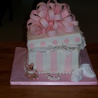 Baby Shower Gift Box fondant covered cake. rice krispie treat lid. gumpaste bow and decorations. design/instructions from elisa straus book