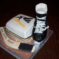 Hockey Birthday Cake thanks to all of my cc friends who helped me with the design for this cake. the penguin cake is fondant covered cake. skate is done out of...