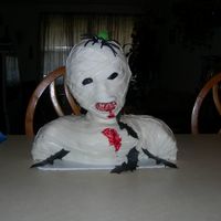 Mummy Cake This is my attempt at a mummy. The cakes are pound with strawberry cream filling meringue icing and fondant strips. Lot's of fun to do...