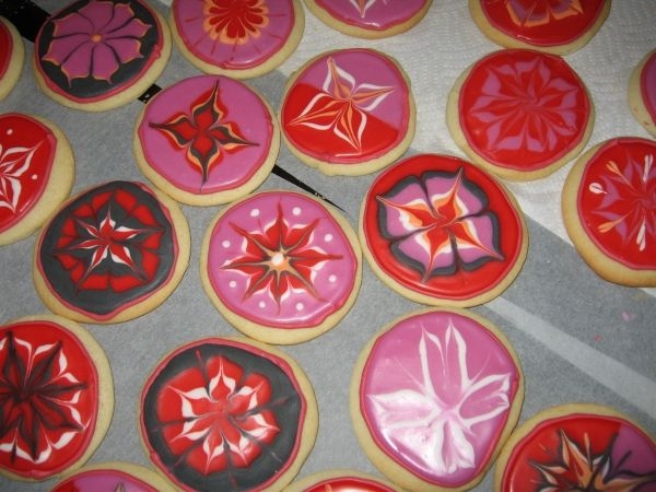 Valentine Cookies Sugar cookies with royal icing and a glaze. I actually mixed the royal and glaze together and i loved the look and it tasted great too!