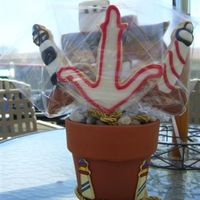 Nautical Cookie Bouquet Bouquet for client who is giving this to a friend that likes lighthouses and freighters.Back cookie is a handcut freighter (first attempt...