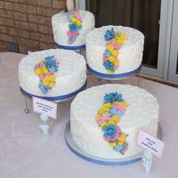 Traditional Spring Floral Wedding Cake Very traditional white buttercream wedding cake with royal icing flowers.