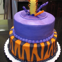 Tigger birthday cake for my sister's 30 th birthday ! She loves tigger ! He is jumping in the cake instead of out because most of this cake...