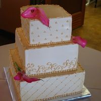 Ivory Wedding Cake This cake was done in all buttercream. Fresh florals on top. I thought it was sweet yet simple. TFL!