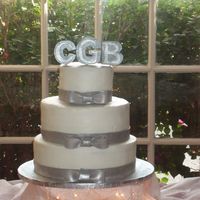 Platinum Cake Buttercream cake with fondant ribbon and monogram in silver luster dust. TFL!