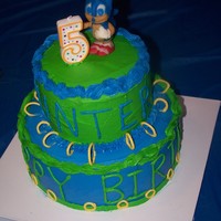 Sonic The Hedgehog Iced in BC with RI rings. Figure on top done with modeling chocolate over RKT.