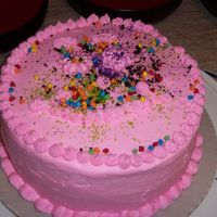 Pink Smile Cake I iced and my 3 yr. old at the time decorated with super mini kisses & sparkle flakes...