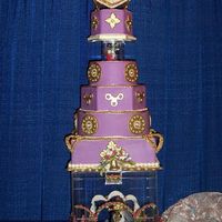 Jumping The Broom Wedding My jumping the broom, five tiers, purple and gold was inspired in the old African American culture. It is described as follows: 4(square),...