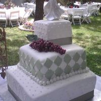 Sage/white Wedding Cake Lemon cream cake with Lemon buttercream filling covered with white and sage fondant and accents