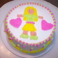 Girl With Hearts This cake was done by my next door neighbors daughter who is 12. I showed her how to color icing, put a cuppling / tip on a bag, fill the...