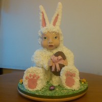 Easter Bunny Baby Inspired By Anne Geddes This is a baby in a bunny suit holding an easter egg was done for easter. inspired from Anne Geddes easter photos.