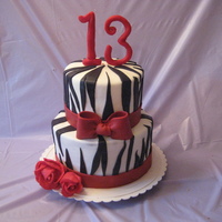 Zebra Stripe Birthday Made this cake for my daughter's birthday. Top is funfetti and the bottom is chocolate mud cake. Both covered in mmf. Roses are...