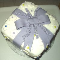 Course 3 Fondant Present Cake With Bow Wilton course 3 fondant present cake with bow and flowers. This was my first fondant cake. I decided not to do the bead border because...