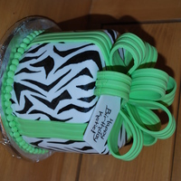 Lil' Zebra Birtday Cake This cake is 6" round cake covered in fondant with fondant/gumpaste bow and gumpaste tag. The zebra stripes were painted on by hand,...