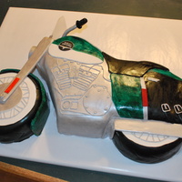 Harley Motorcycle Cake This cake was made to look like the person's actual motorcycle that he has. I used a half sheet size pan and some 8" round pans...