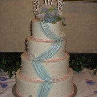 Blue Swags This was my second attempt at fondant swags and I was a little anxious. I was happy how they turned out. I put them on the tiers before...