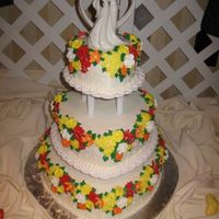 Fall Flowers This cake was Wilton inspired, just a change in color and some of the flowers. The flowers are royal icing. I loved the fall colors the...