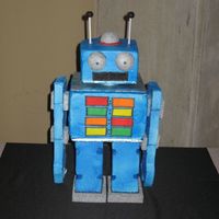 Robot This was for the groom at the rehersal dinner. It was my first 3-D cake so it took alot longer than the next one will.