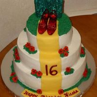 We're Off To See The Wizard! This cake was for a Sweet 16 party where the theme was the Wizard of Oz. Cake was covered in buttercream, royal icing poppies and MMF...