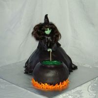 Halloween Witch At Cauldron Inspired by the awesome cake made by mommykicksbutt and posted to CC. This was so fun to make. Wondermold for witch, 2 small pyrex bowls...
