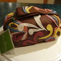 Vera Bradley Purse Cake A Vera Purse for my cousin's 24th birthday. Baked in a loaf pan & covered with chocolate MMF.