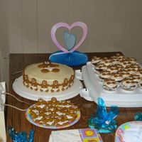 Baby Shower Cake With Baby Gingerbread Men A carrot cake with cream cheese frosting topped with baby gingerbread men for a Dec 23rd baby shower