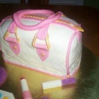 Purse Cake My first purse cake. It was lots of fun. I used loaf pans. And molds for the makeup.