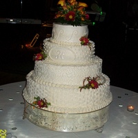 Wedding Cake - 4 Tier Round Walker-Hemmer Wedding Cake - Downtown KC (Sept 2009)...all white cake / buttercream icing - colorflow monogram "H"