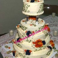 Fall Splendor This was the first wedding cake I ever made. It is 5 Tiers, buttercream icing with silk flower accents.