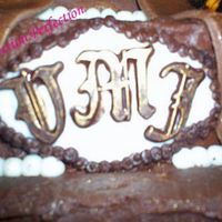 Close Up Of Monogram Made out of Chocolate and Fondant, Accented with Luster Dust