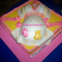 Double Trouble I was inspried by all of the other pregnant belly cakes on CC and I couldn;t wait for a reason to do this cake. My friend is having twins...