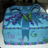 Present Stlye Cake Vanilla cake w/ bavarian cream filling. Vanilla bc and fondant accents. For a little girl who loves blue. TFL