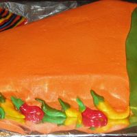 Chili Pepper wilton's pennent pan makes a great chili pepper! My 6 yr old son's idea. butter rum frosting with Choco pan accents