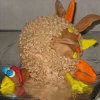 Turkey ball cake w/ buttercream and fondant head, legs, and feathers. I made this for our church auction at Thanksgiving!